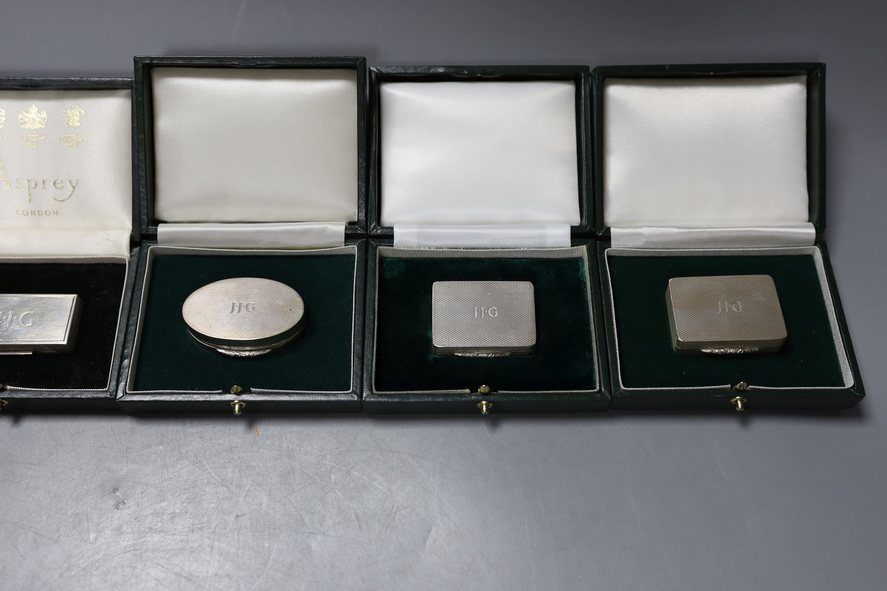 Six assorted modern cased silver or parcel gilt silver pill boxes by Peter John Doherty, Birmingham, 1969-1996, largest 5cm, all in fitted Gallagher boxes, one by Asprey.